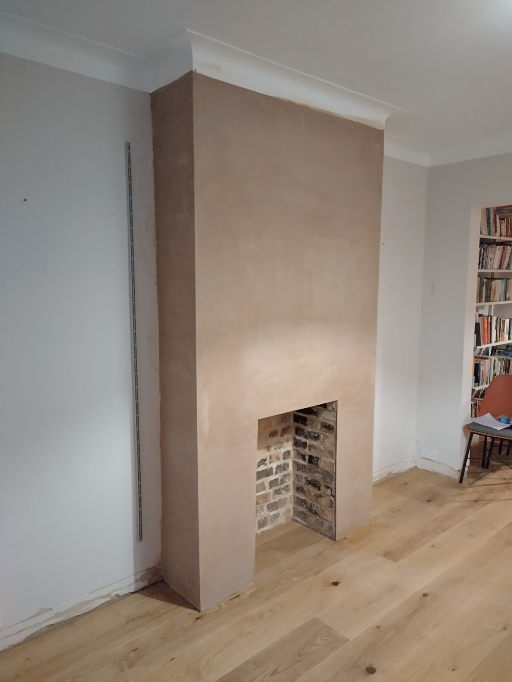 Restored chimney breast after fireplace removal in Middle Park, London